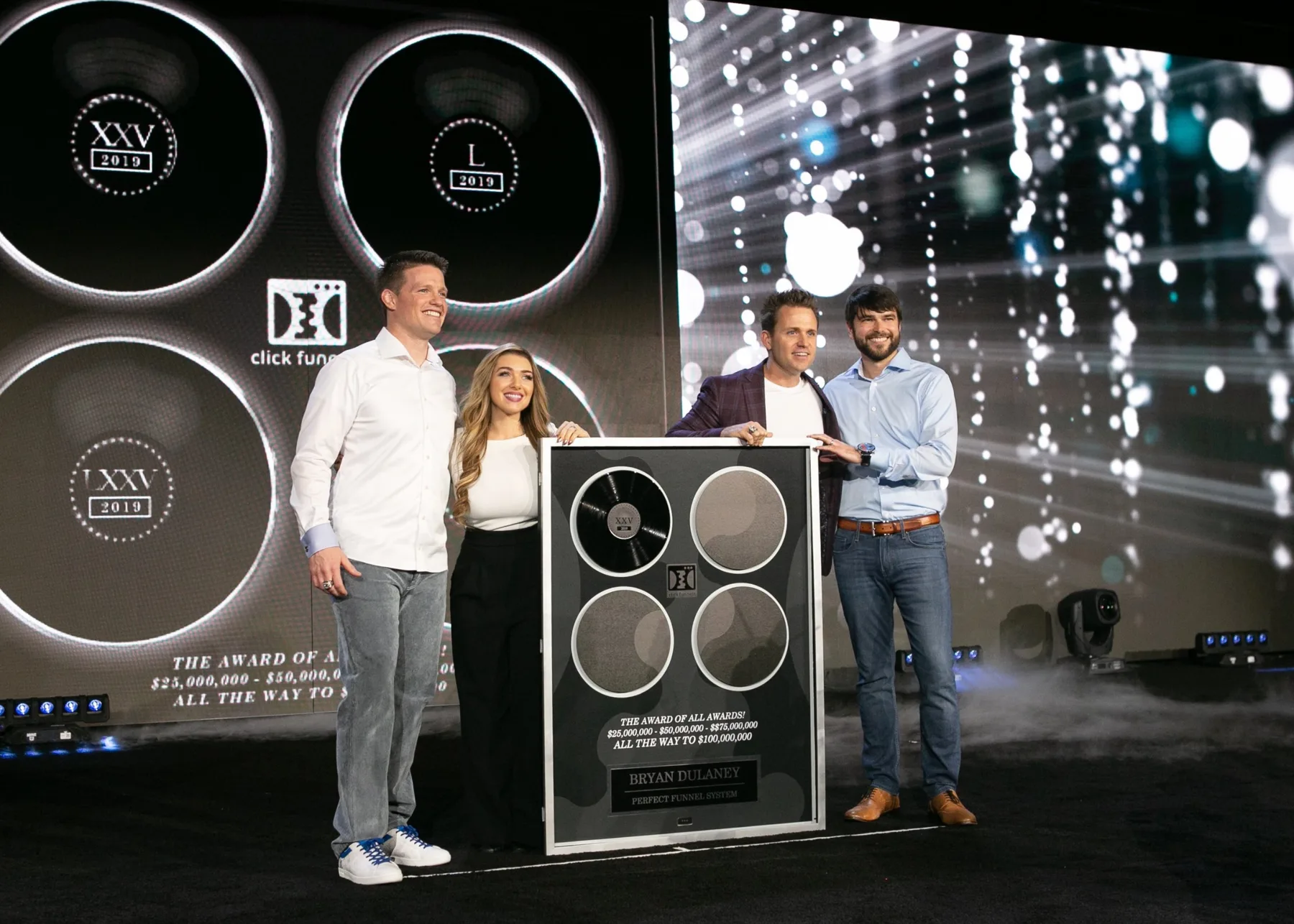 Stephanie and Bryan receiving the ClickFunnels Award of All Awards